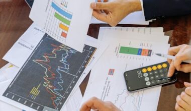 people working with documents showing charts.